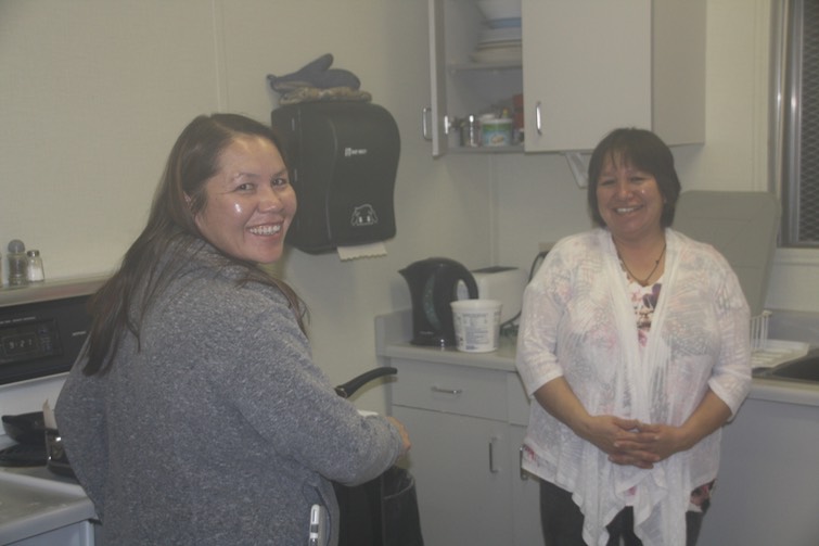 Vicky and Ally slaving away in the kitchen making bannock for us!